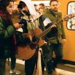 Public Speaking, Skills - Musicians playing guitar on subway station