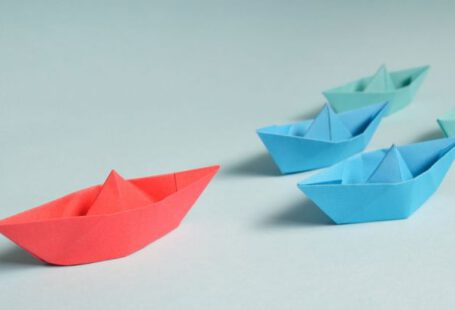 Transition, Leadership - Paper Boats on Solid Surface